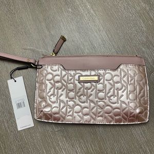 Calvin Klein large wristlet in rose gold. Tag still on